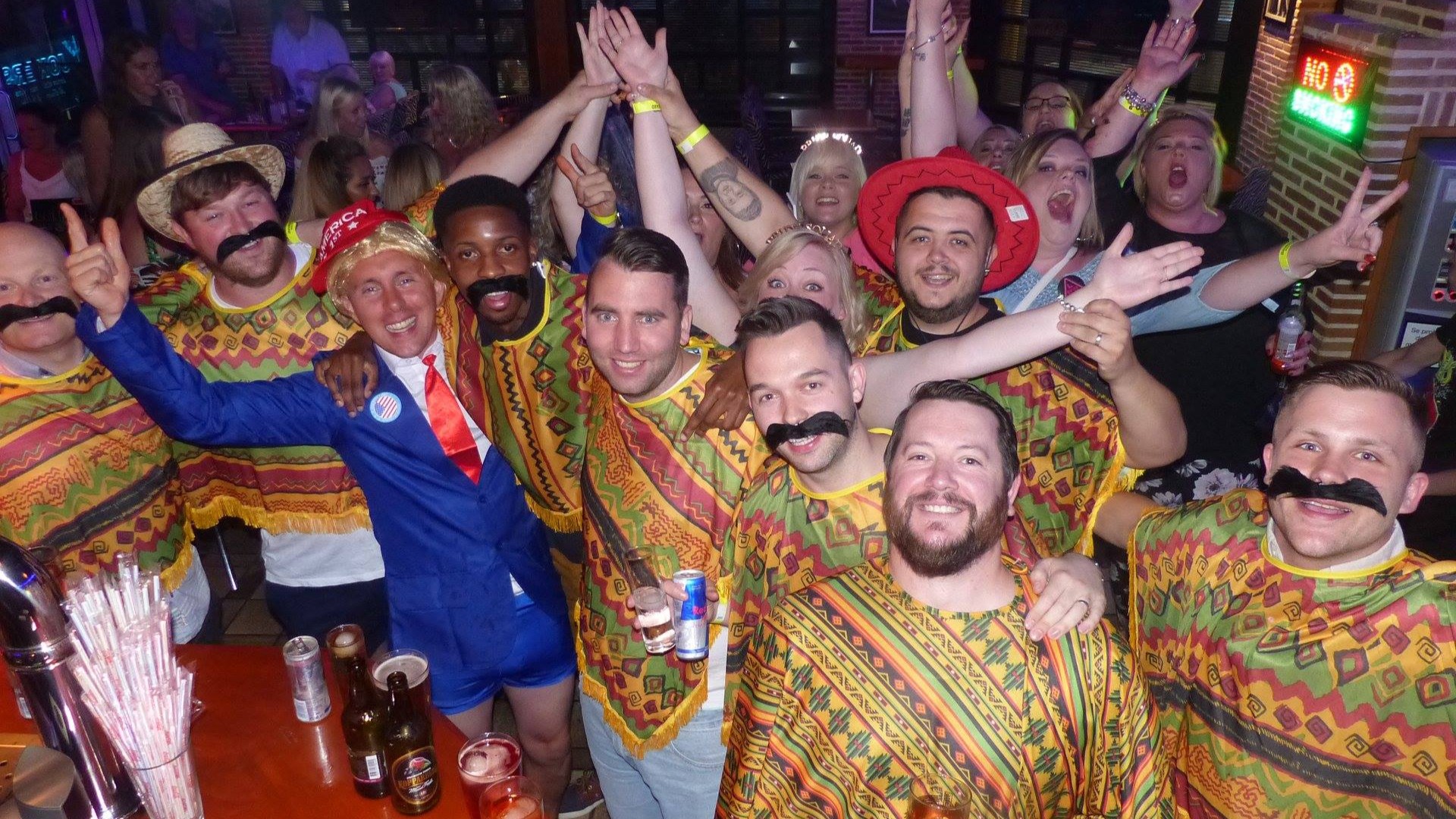 lads in a bar dressed up as Mexicans